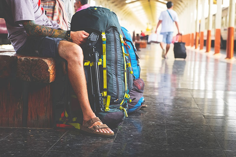 Travelers with backpacks and luggage